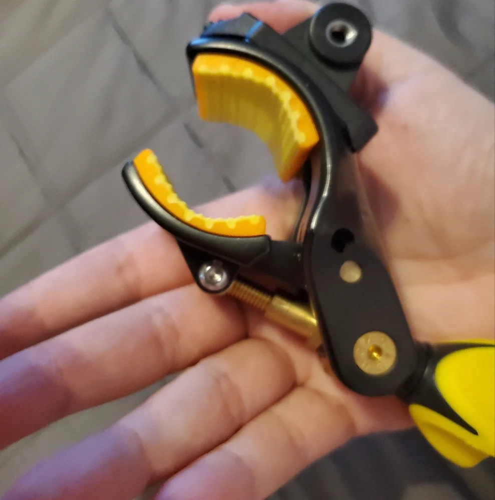 Yellow and Black Camera Tripod Clamp